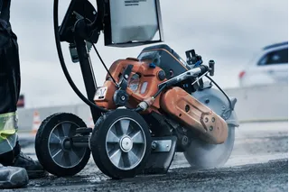 Husqvarna K770 power cutter in use cutting road surface