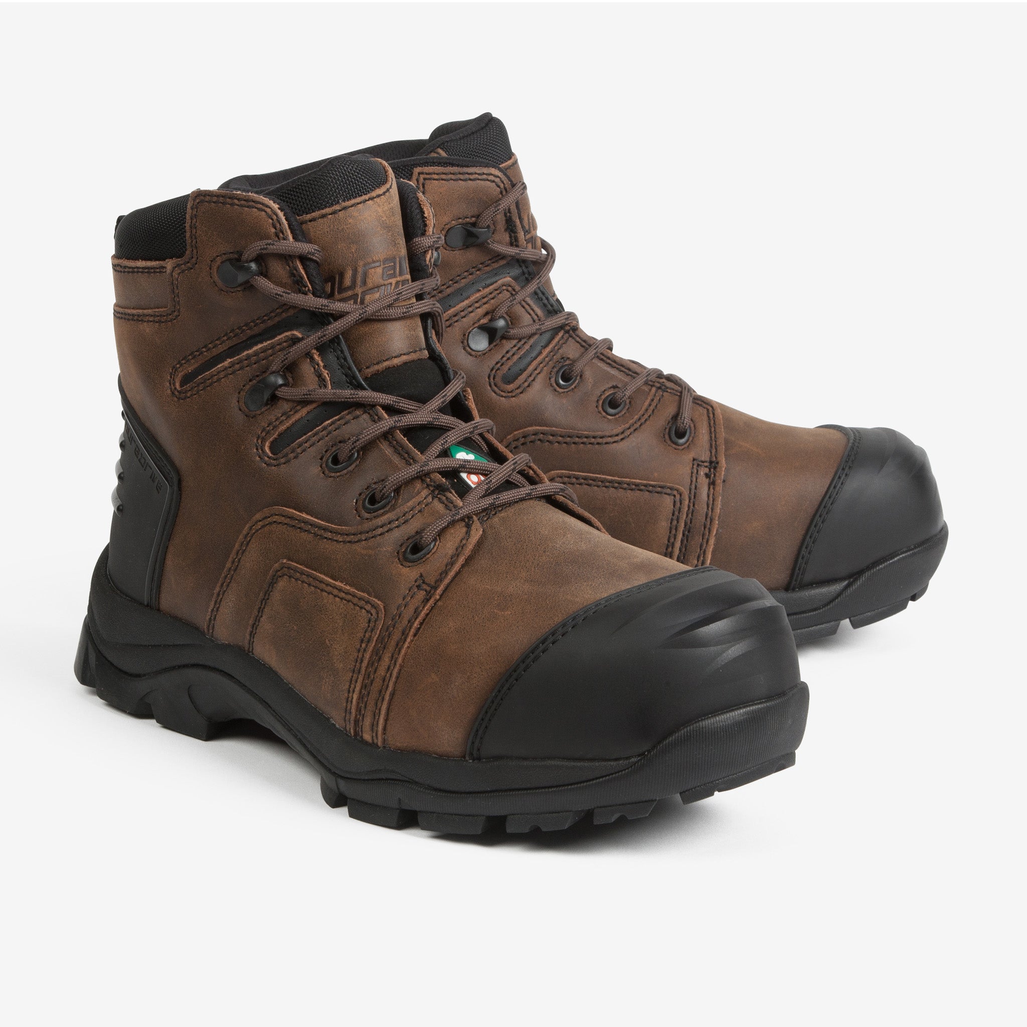 Pair of brown work boots with black soles on a white background