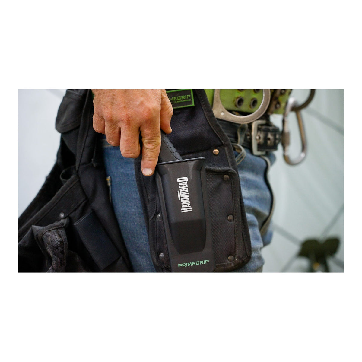 Primegrip Hammerhead roofing knife carried in a roofer's tool belt