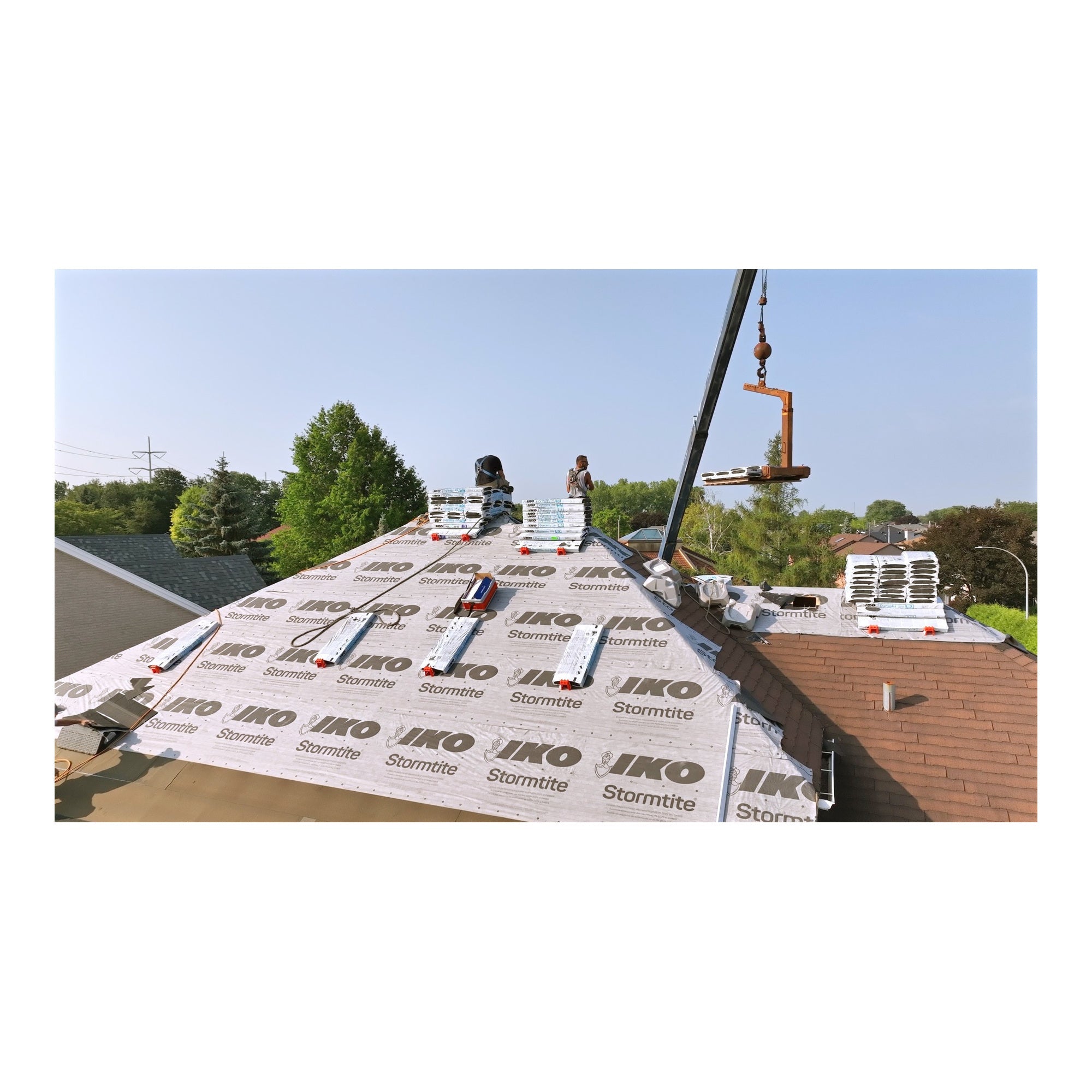 Roofing crew using Primegrip BMF Shingle Anchors for roof materials