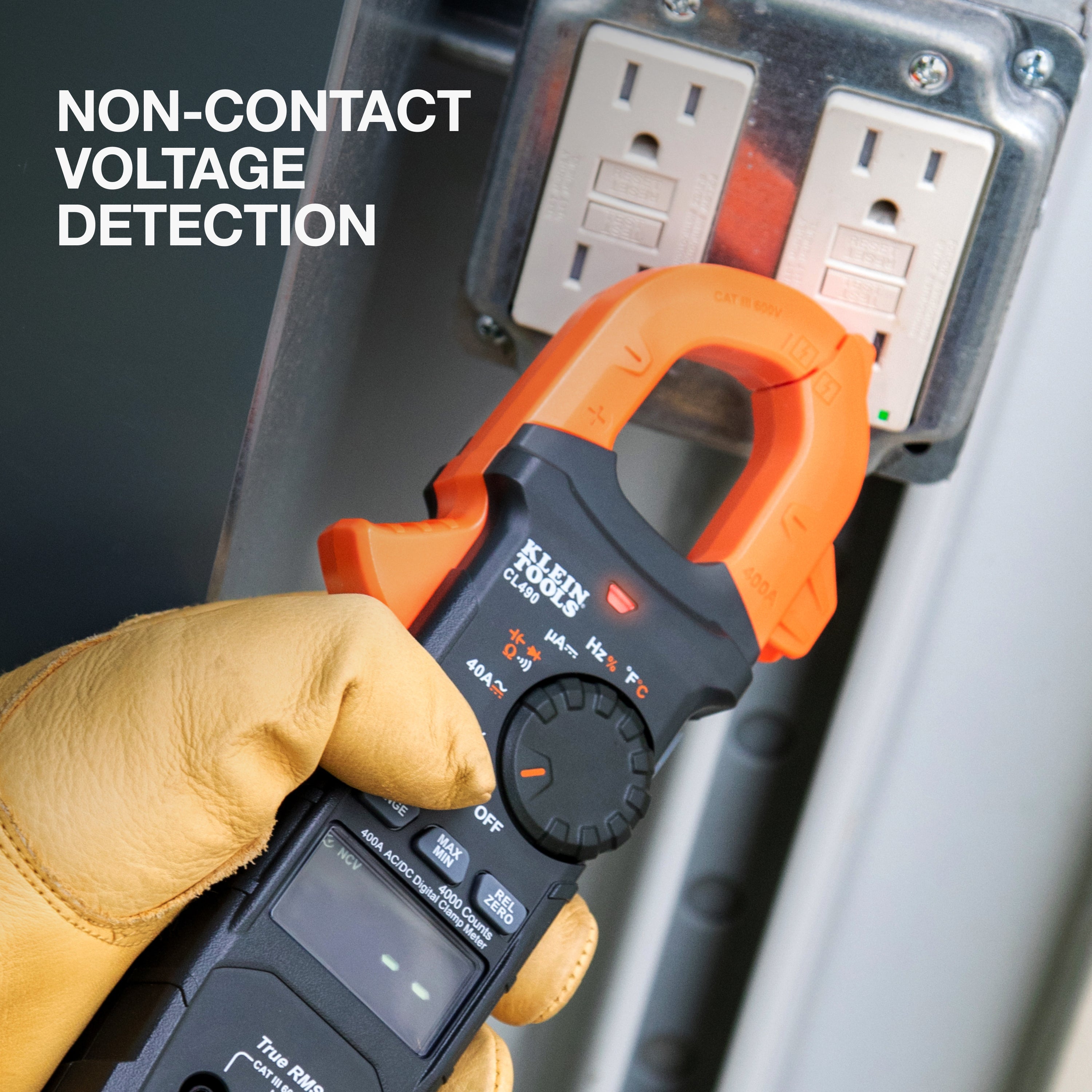 Multimeter with non-contact voltage detection feature being used on a power outlet.